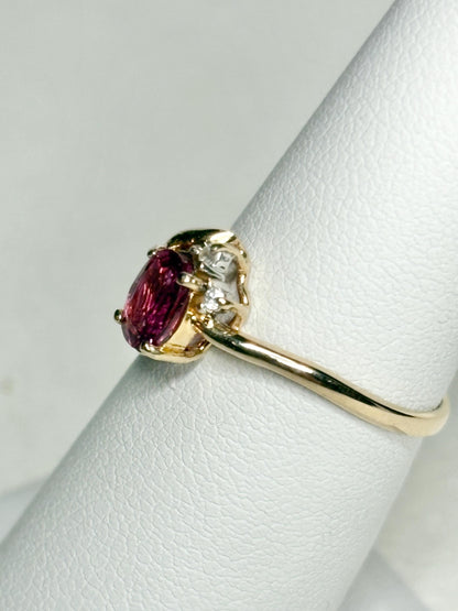 Pink sapphire and diamond ring in solid 14k gold.