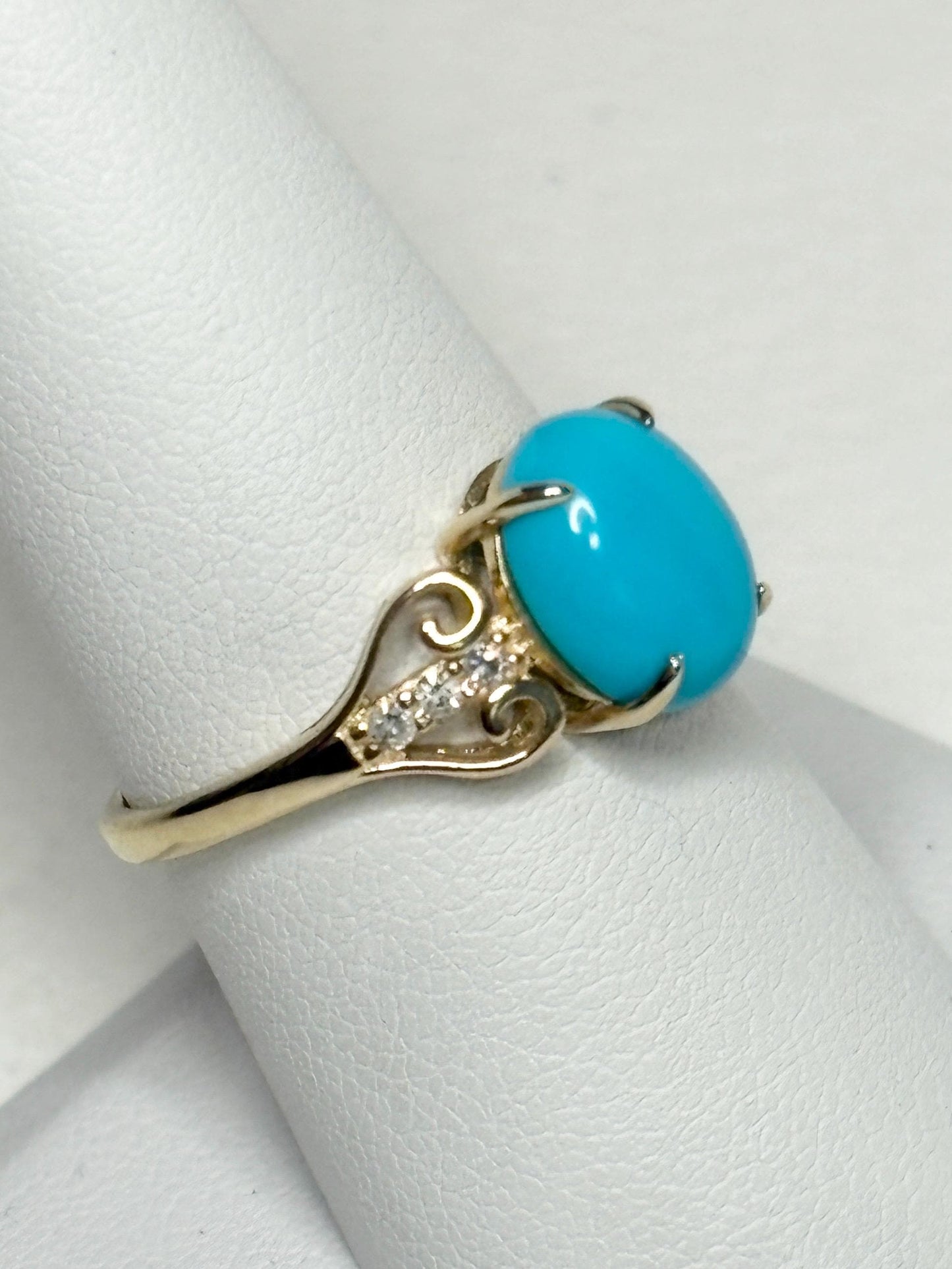 10k gold ring with oval Sleeping Beauty turquoise and accent diamonds.