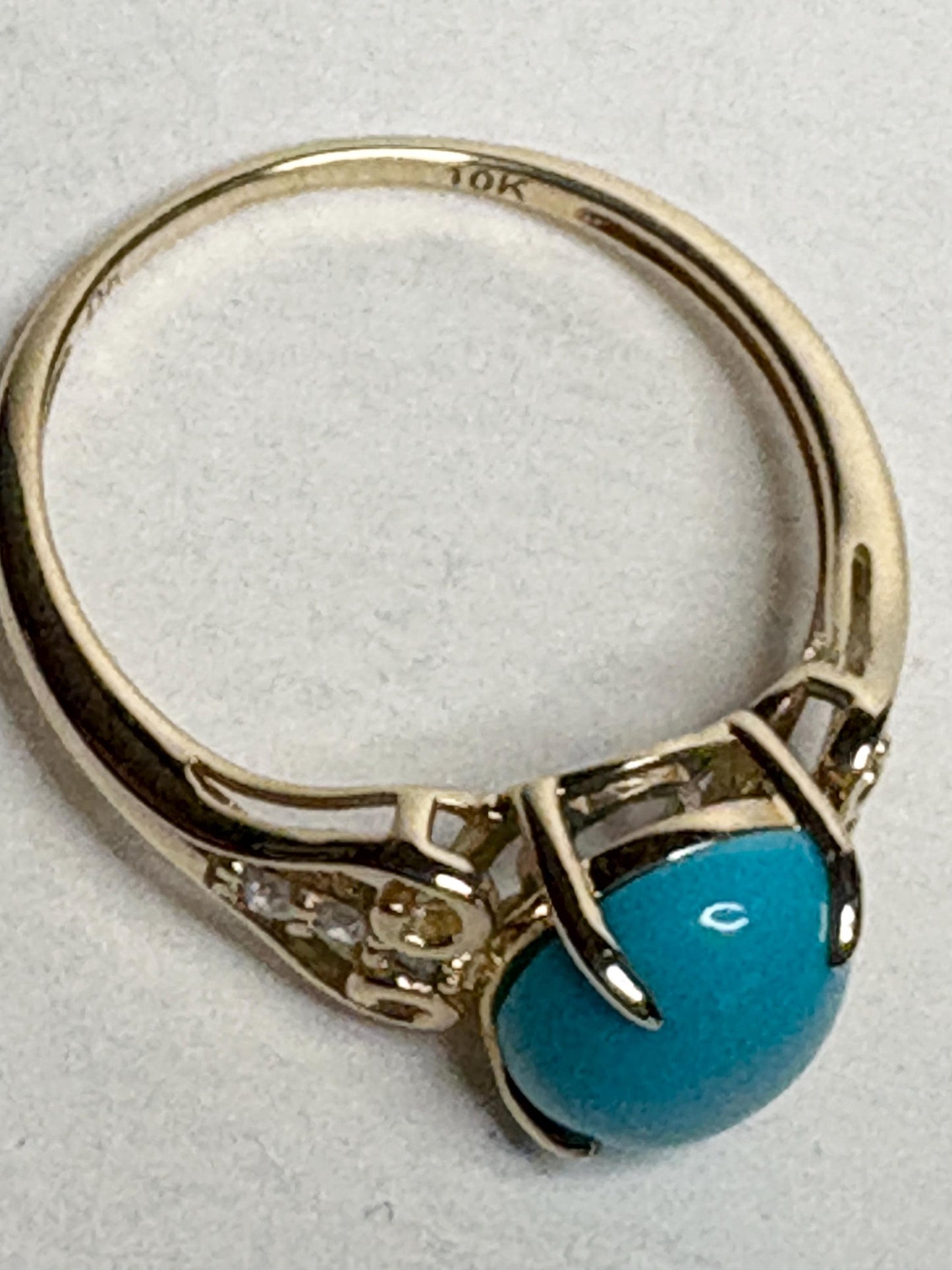 10k gold ring with oval Sleeping Beauty turquoise and small diamonds.