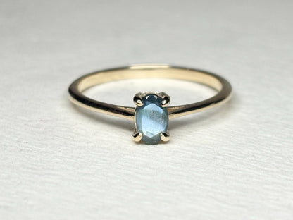 Oval alexandrite solitaire ring in 10k gold.