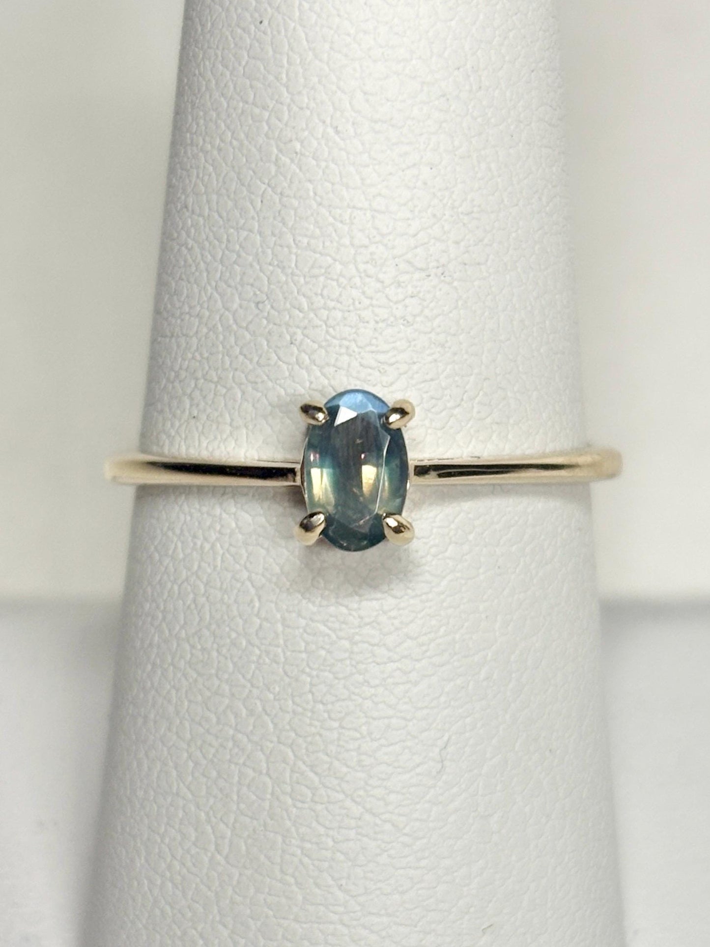 Oval alexandrite chrysoberyl solitaire ring in 10k gold.
