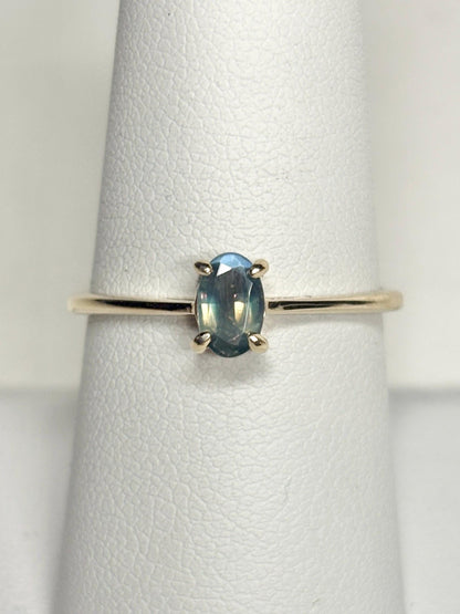 Oval alexandrite chrysoberyl solitaire ring in 10k gold.