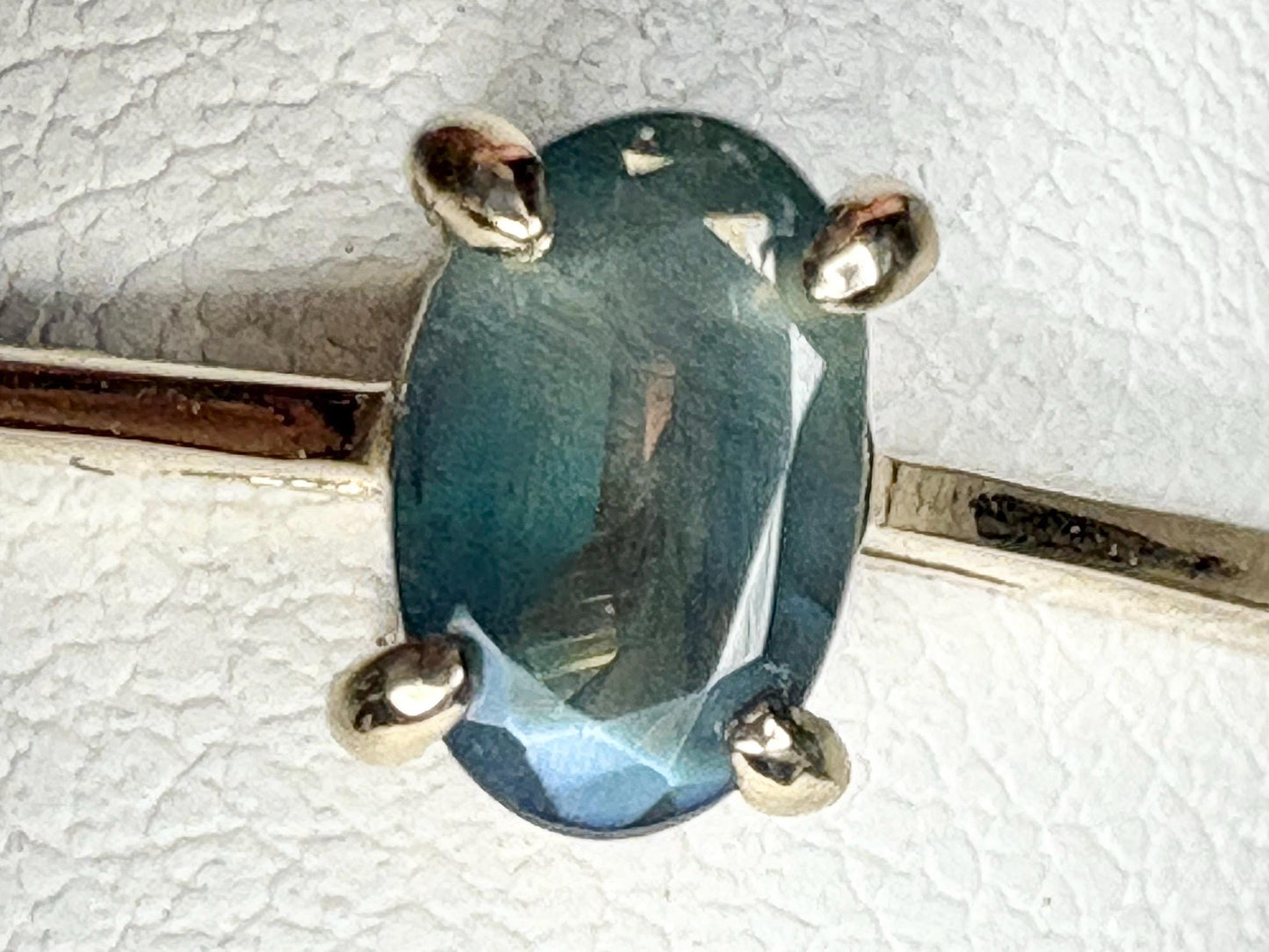 Oval alexandrite chrysoberyl solitaire ring in 10k gold.