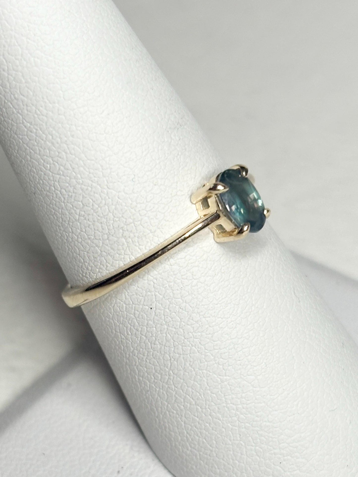 Oval alexandrite chrysoberyl solitaire ring in 10k gold.