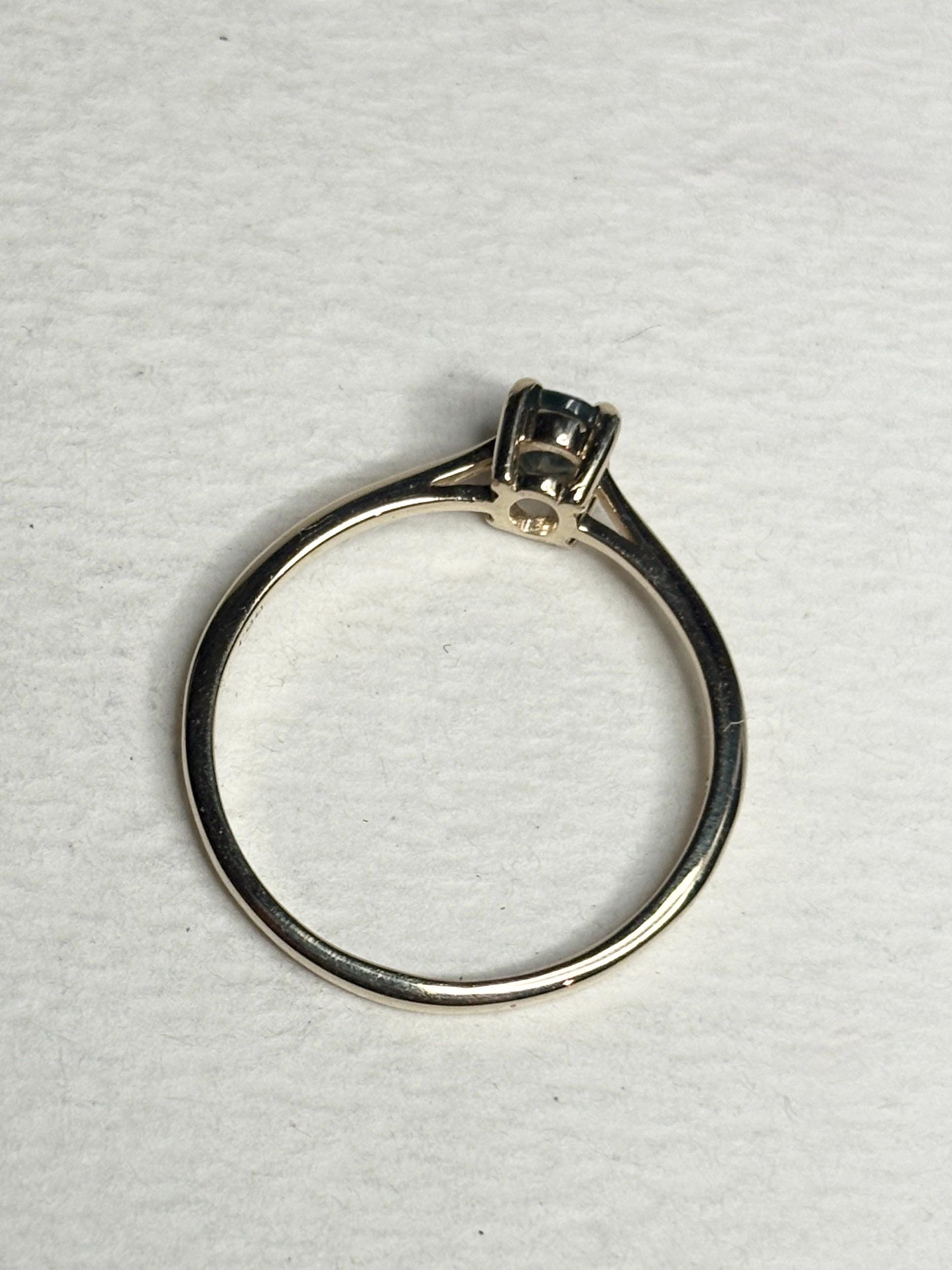 Oval alexandrite solitaire ring in solid 10k gold.