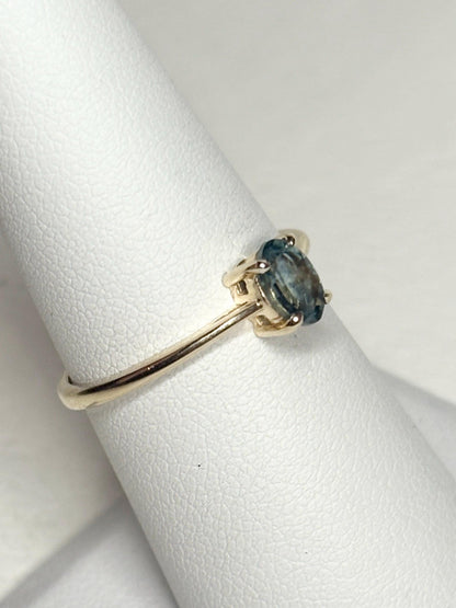 Oval Montana sapphire solitaire ring in solid 10k gold.