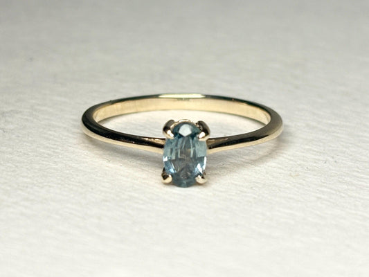 Oval Montana sapphire solitaire ring in solid 10k gold.
