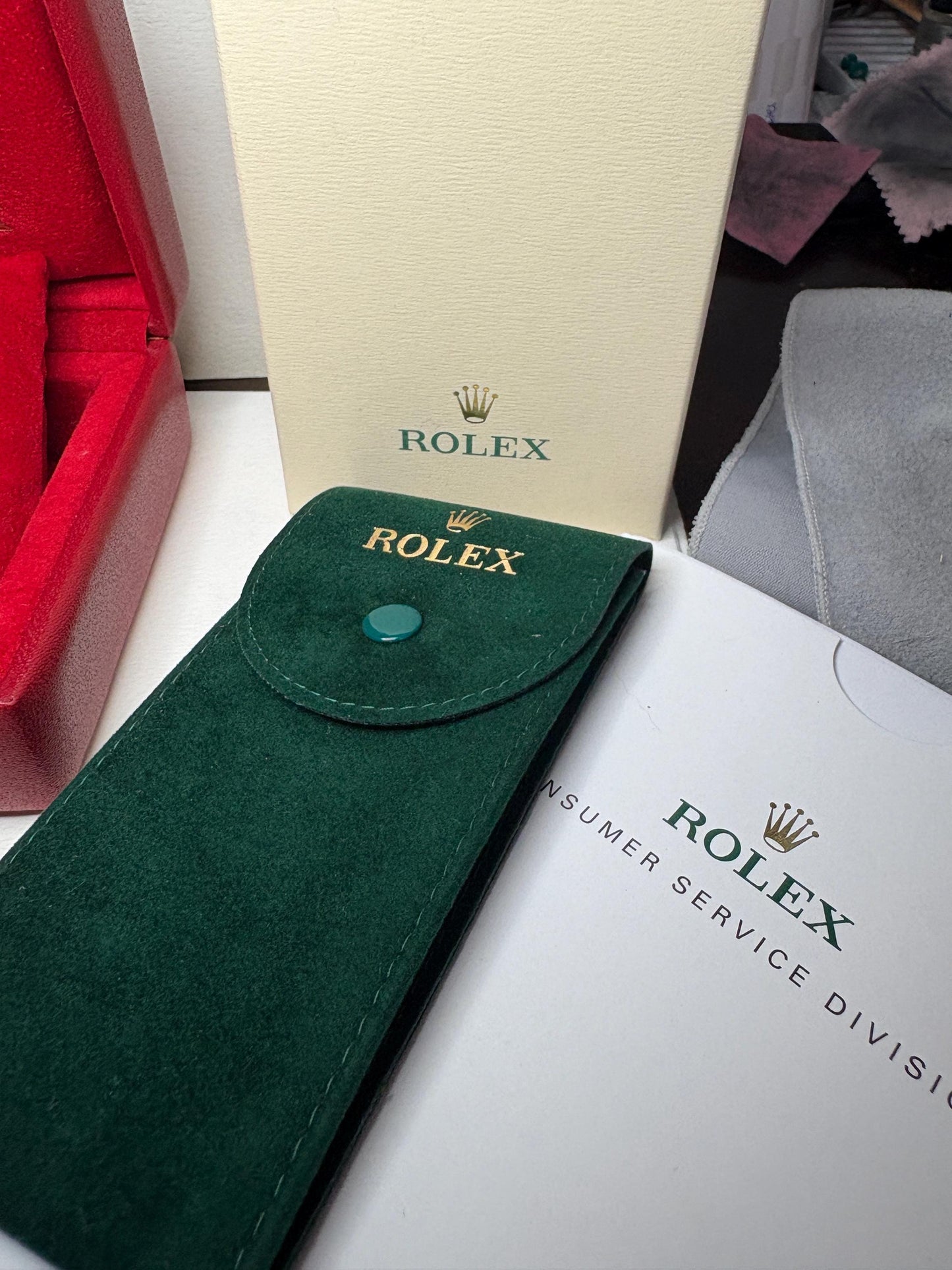 Rolex box, pouch, and paperwork.