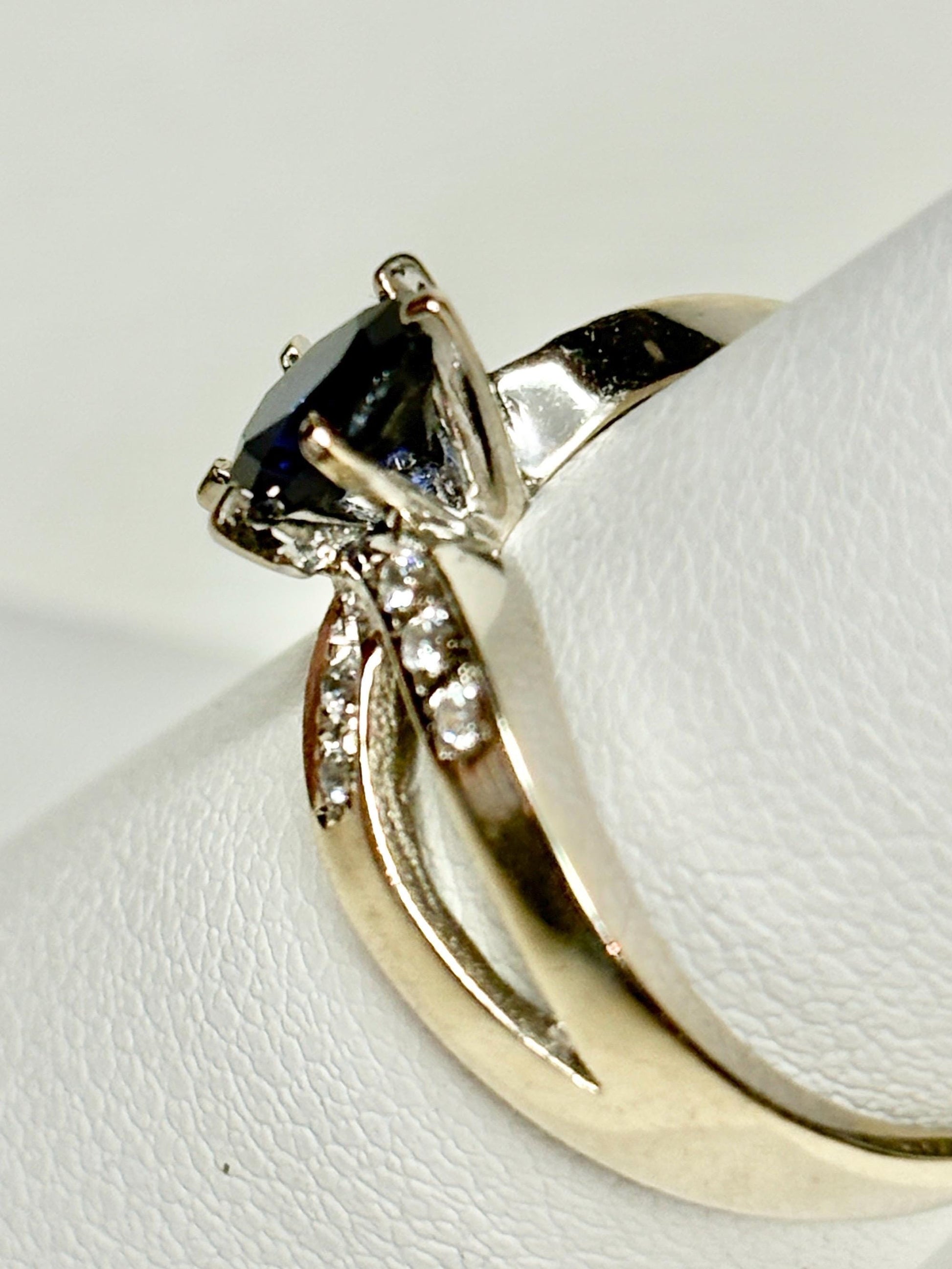 A vivid blue sapphire and diamond ring in 18k white gold.