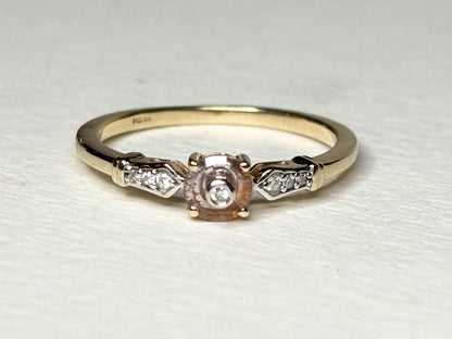 A 9k gold ring with a Montana sapphire and diamonds.