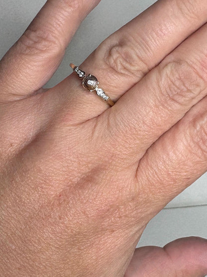 A 9k gold ring with a Montana sapphire and diamonds.