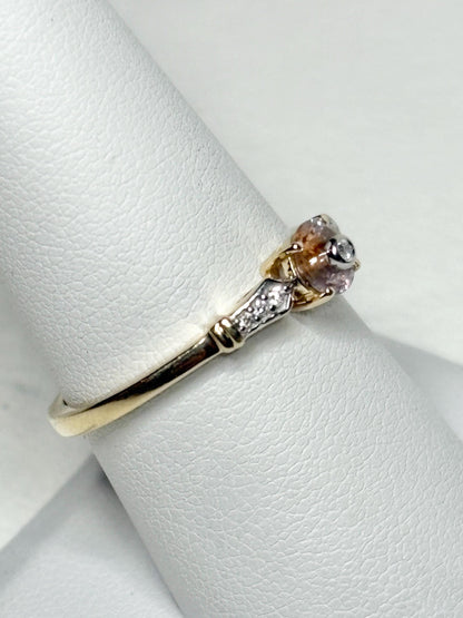 A 9k gold ring with a bi-color Montana sapphire and .07ct diamonds.