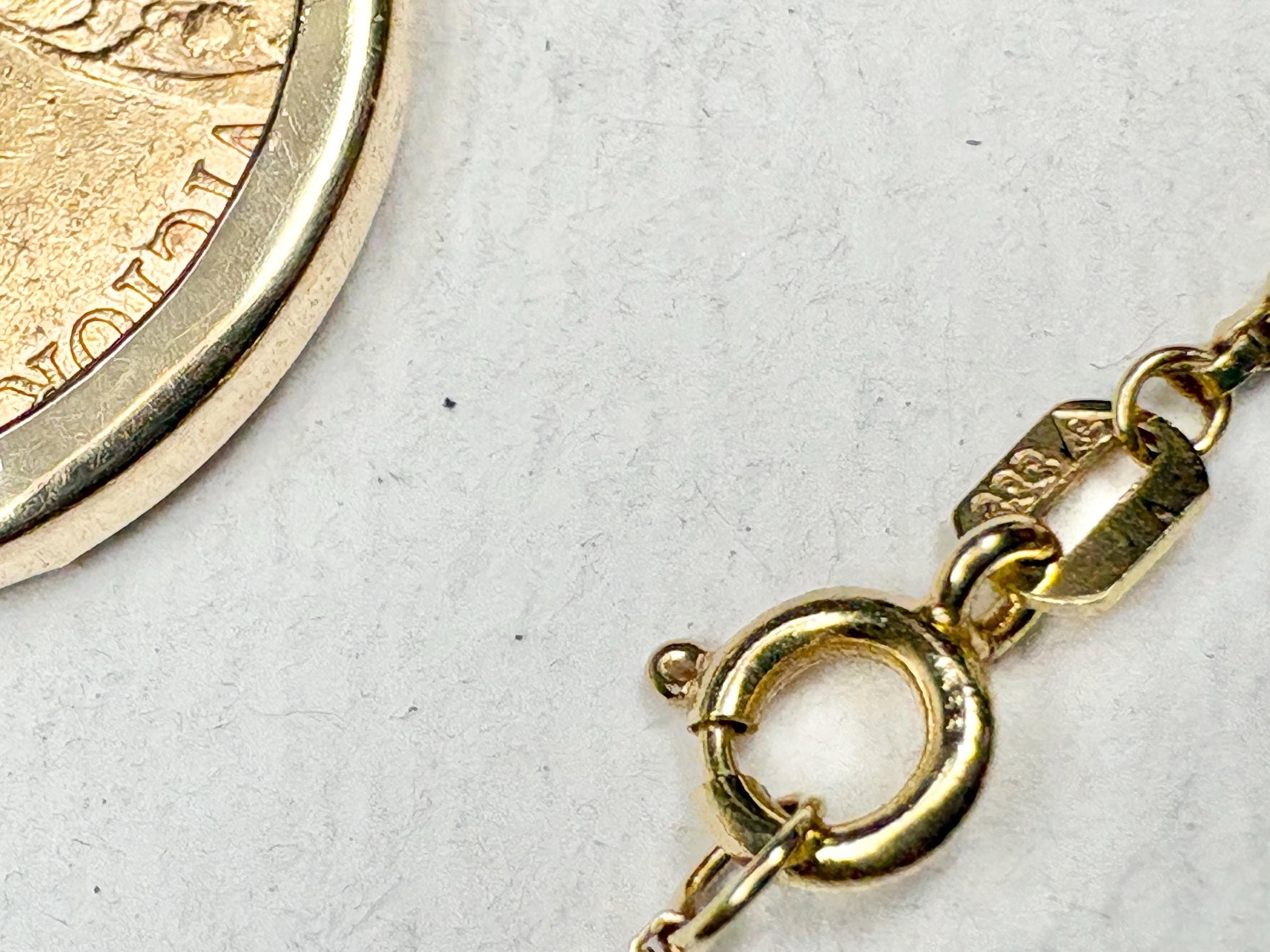 Gold coin pendant with Queen Victoria and a gold chain.