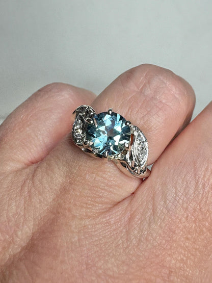 Vintage 14k white gold ring with blue topaz and diamonds.