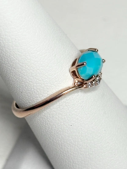 Rose gold ring with oval checkerboard faceted turquoise and diamonds.