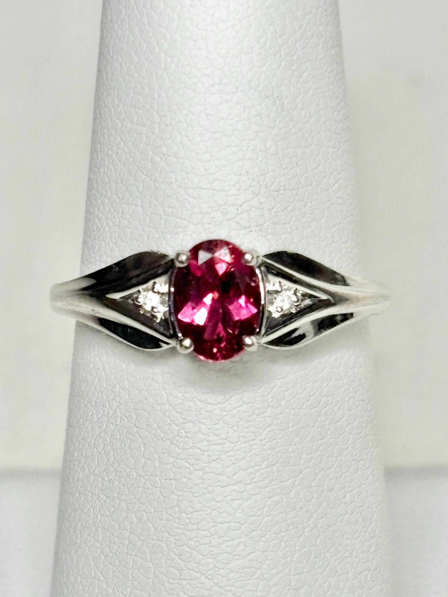 Oval rubellite tourmaline and diamond ring in 10k white gold.