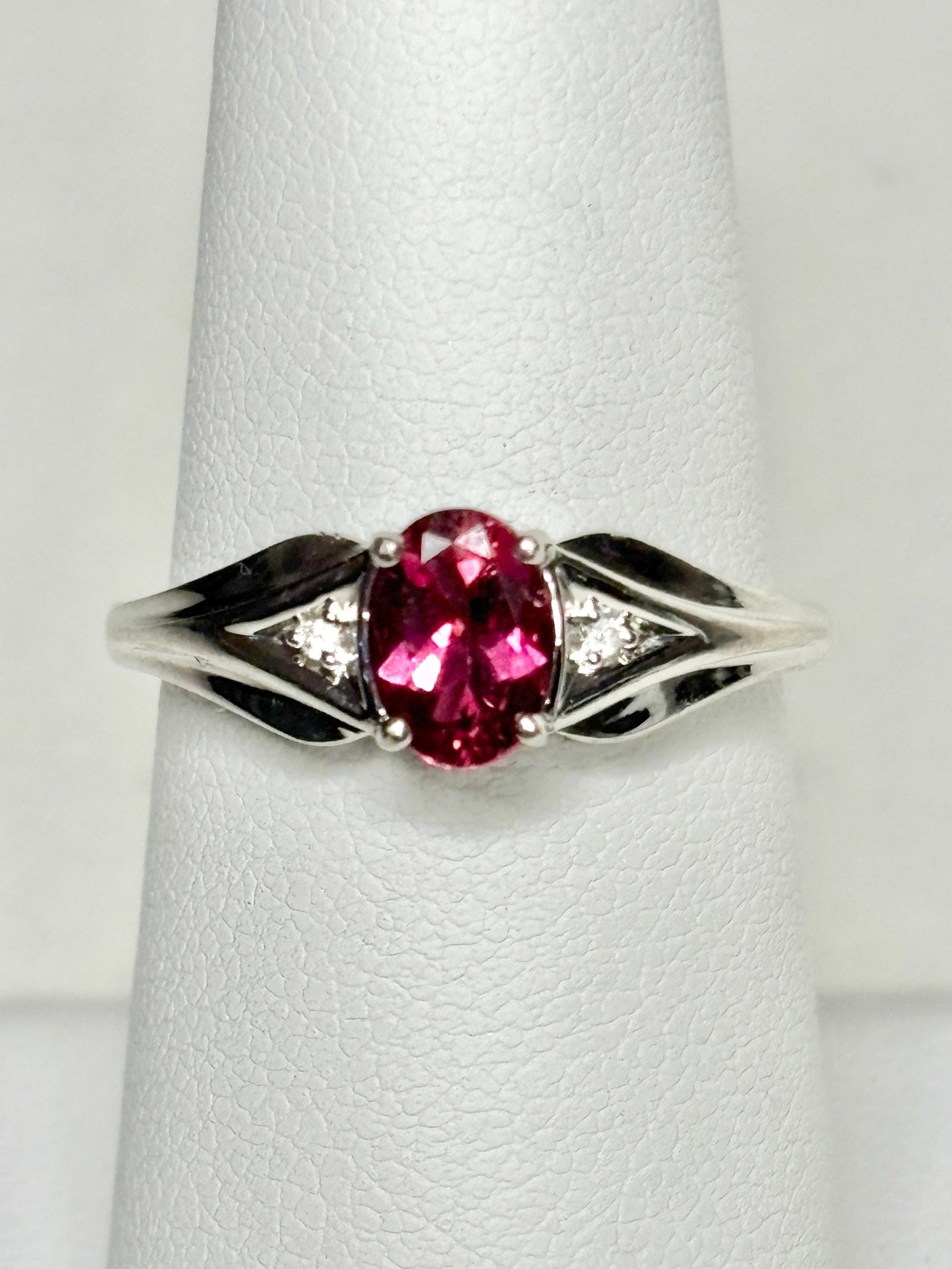 Oval rubellite tourmaline and diamond ring in 10k white gold.