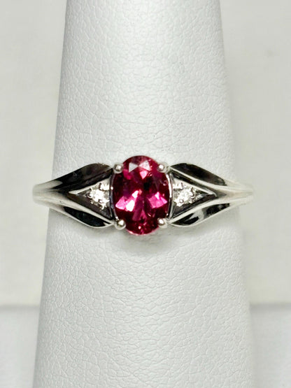 Oval rubellite tourmaline and diamond ring in 10k white gold.