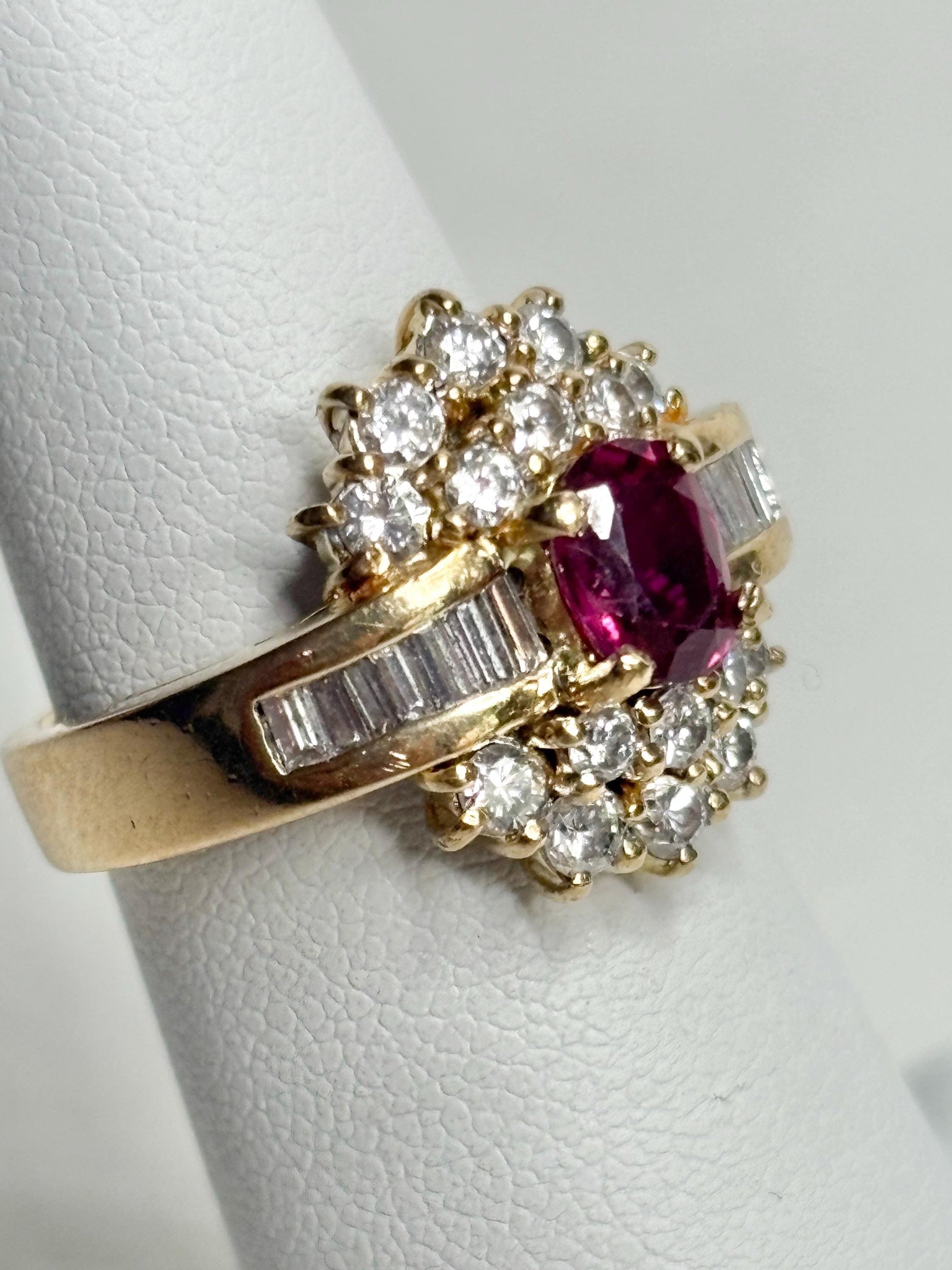 18k gold cocktail ring with ruby and diamond accents.