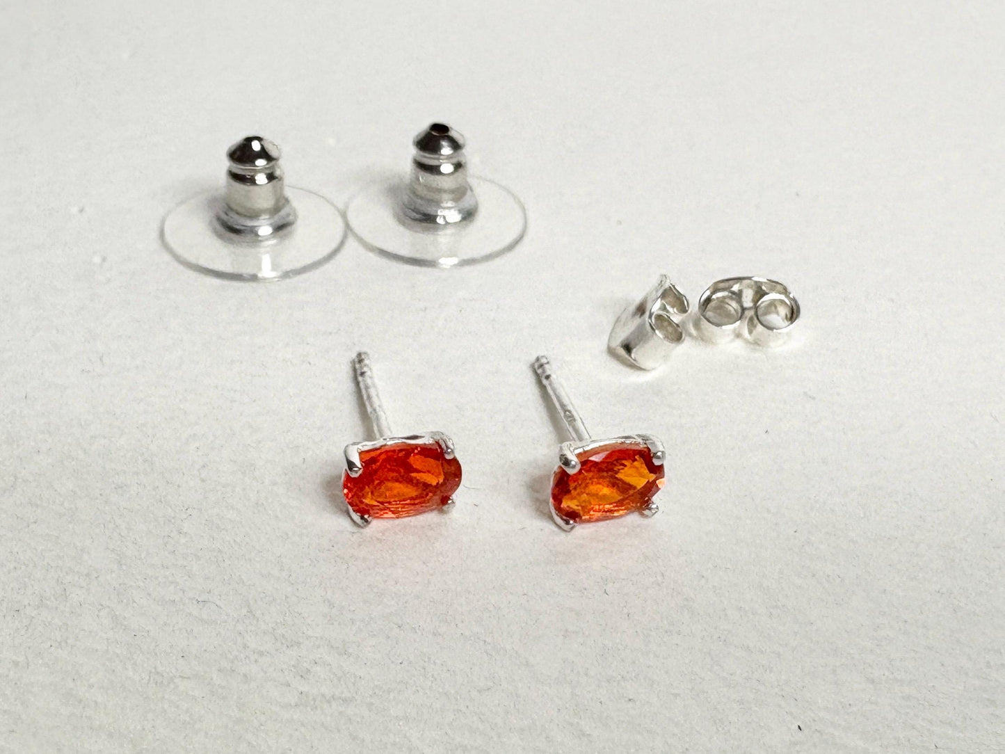 Sterling silver stud earrings with 6x4mm oval Mexican fire opals.