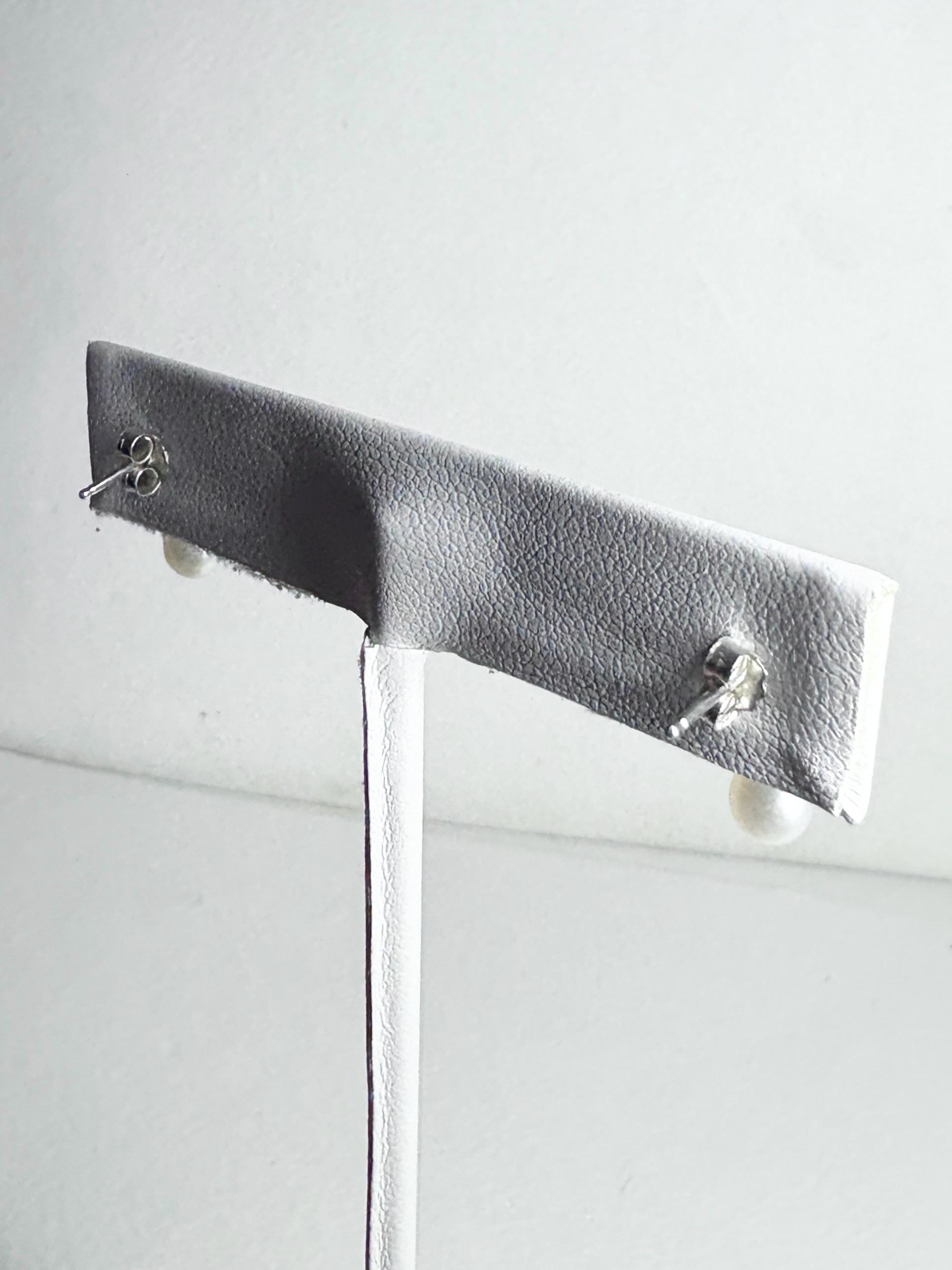 Sterling silver dangle drop earrings with vintage freshwater pearls.