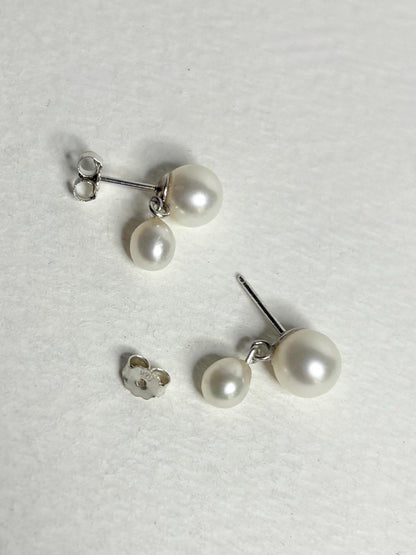 Sterling silver dangle earrings with vintage freshwater pearls.