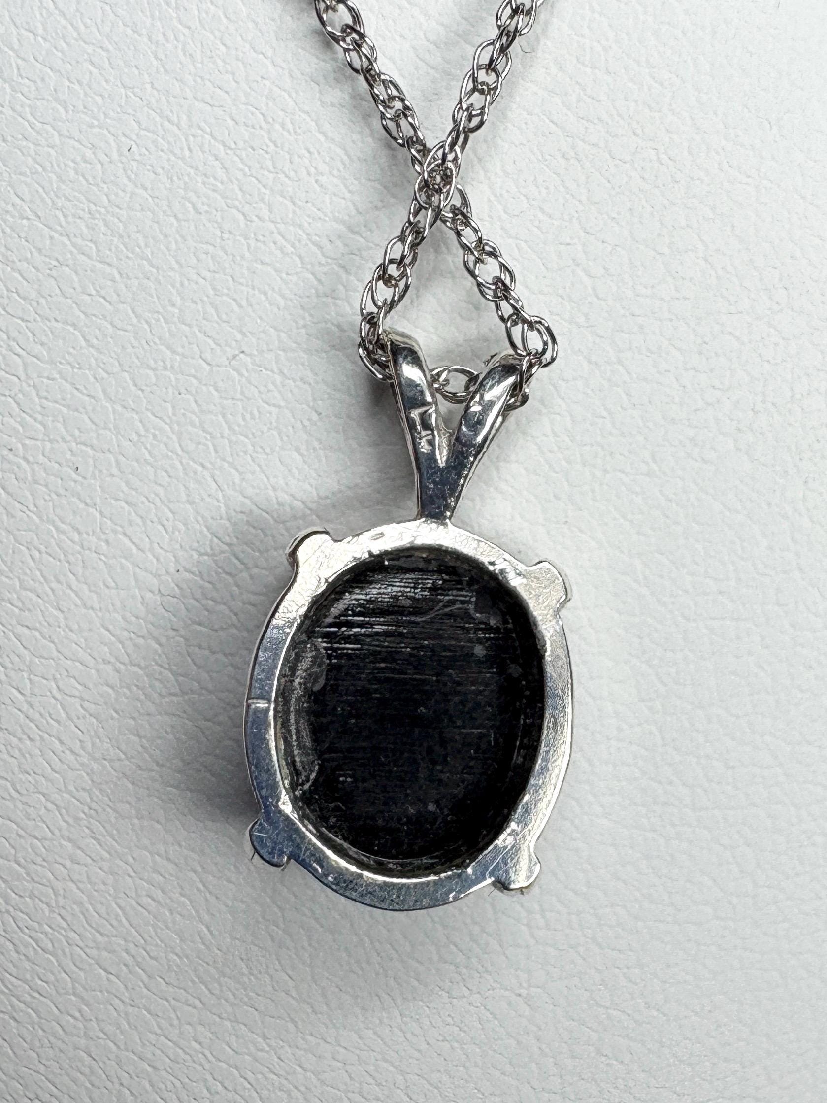 Sterling silver pendant necklace with a black triplet opal solitaire.