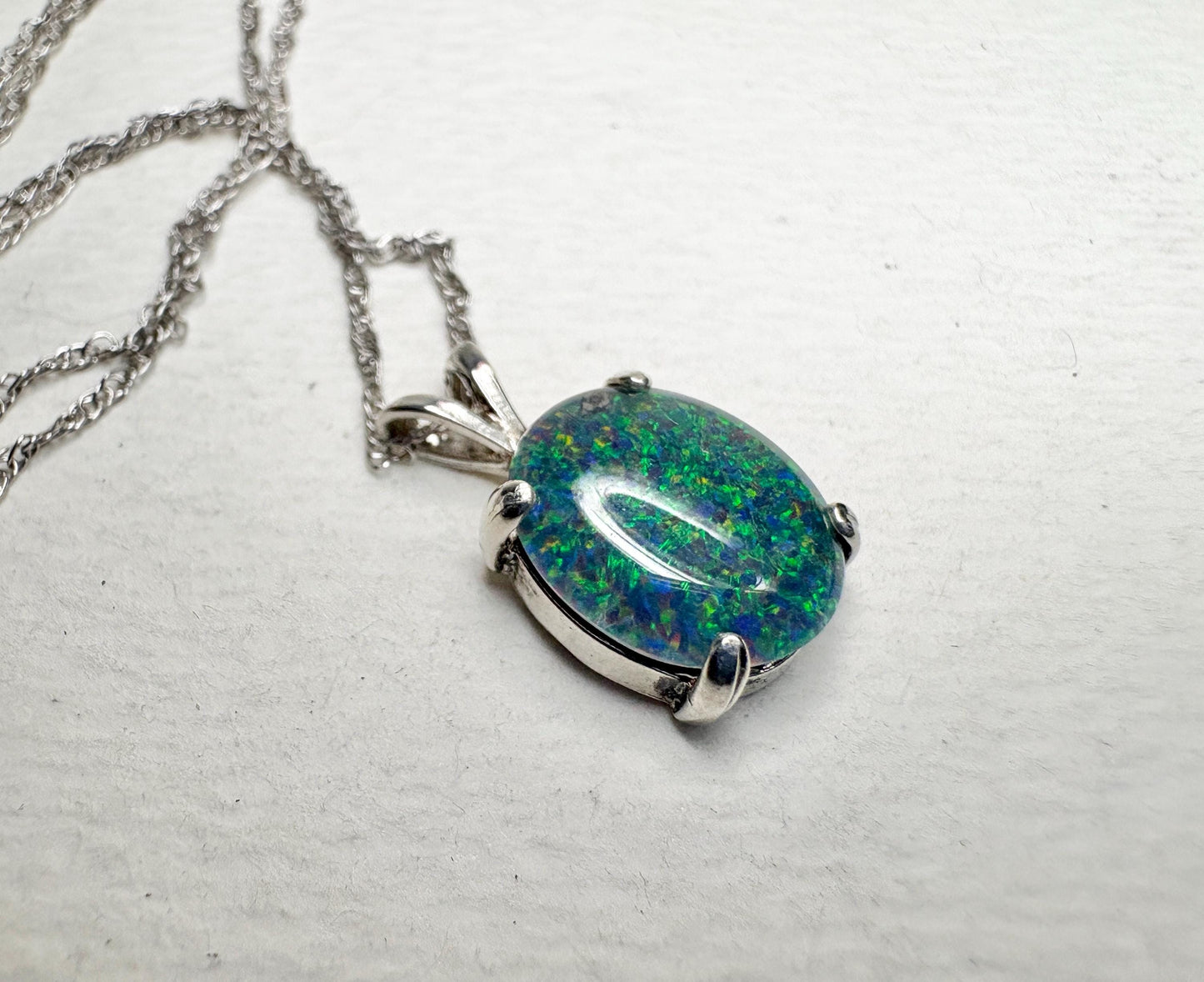 Sterling silver pendant necklace with an oval Australian opal triplet.