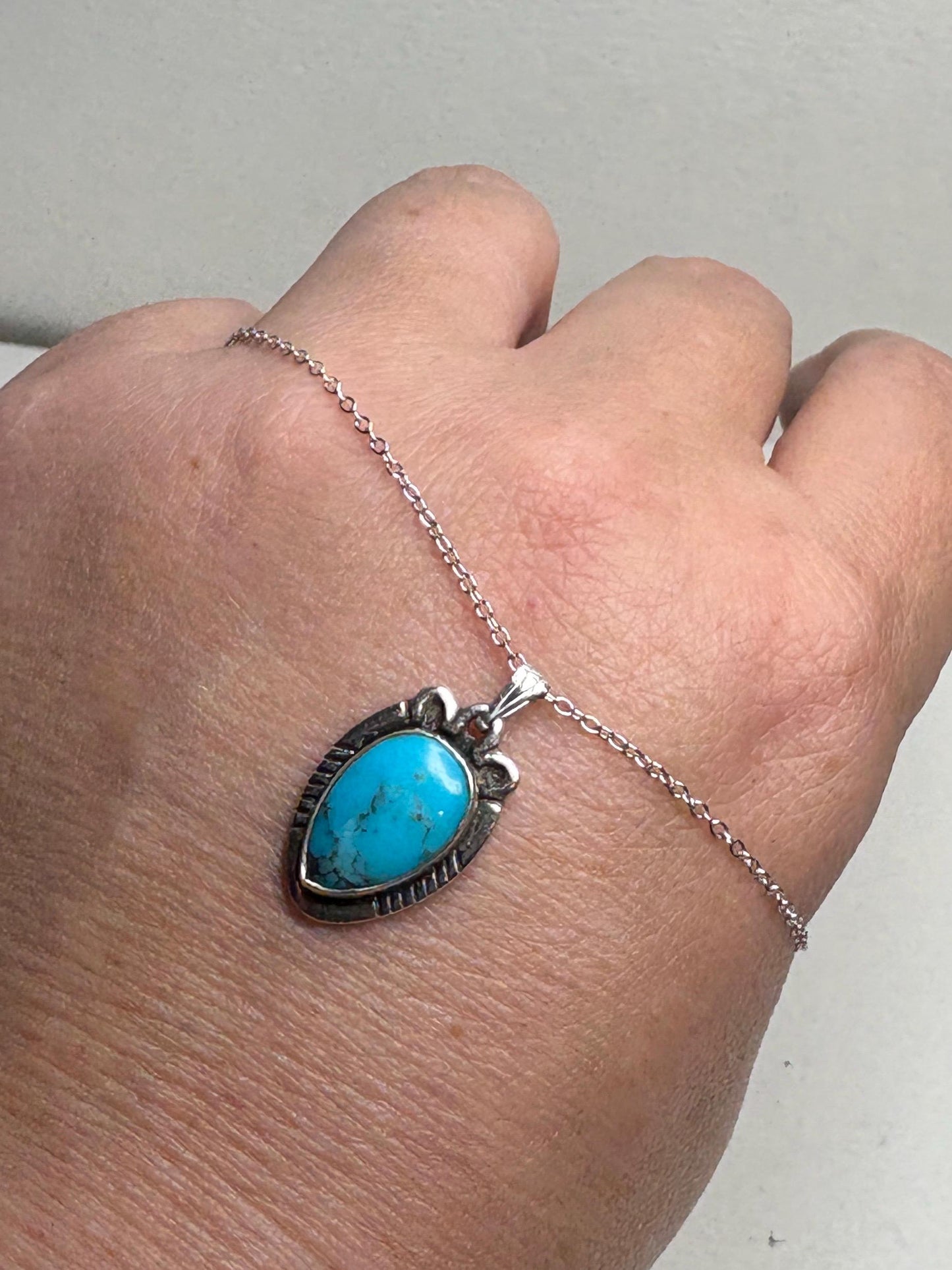 Vintage Southwest style sterling silver pendant necklace with natural turquoise.
