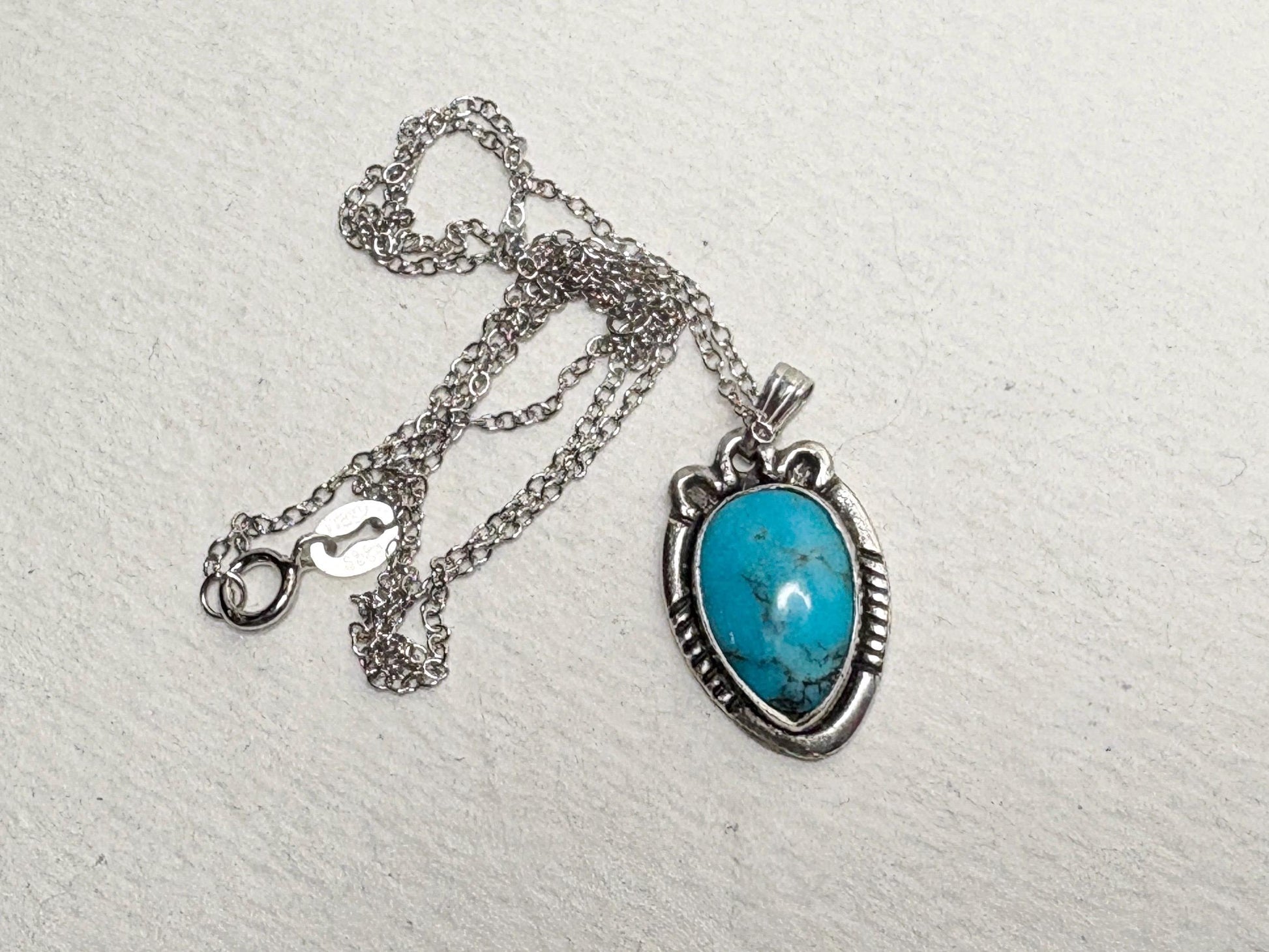 Vintage turquoise pendant necklace with adjustable chain.