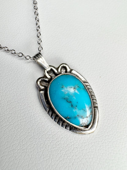 Vintage Southwest style turquoise pendant necklace with adjustable chain.