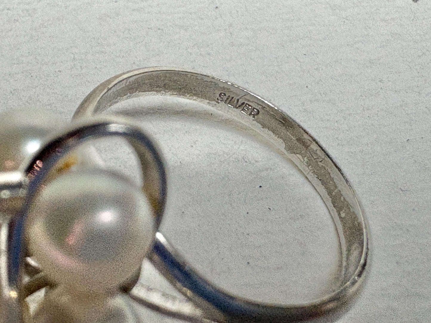 Sterling silver ring with six Akoya cultured pearls, size 6.75.