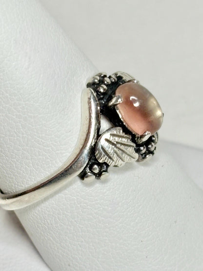 Vintage sterling silver ring with a bicolor Oregon sunstone cabochon.