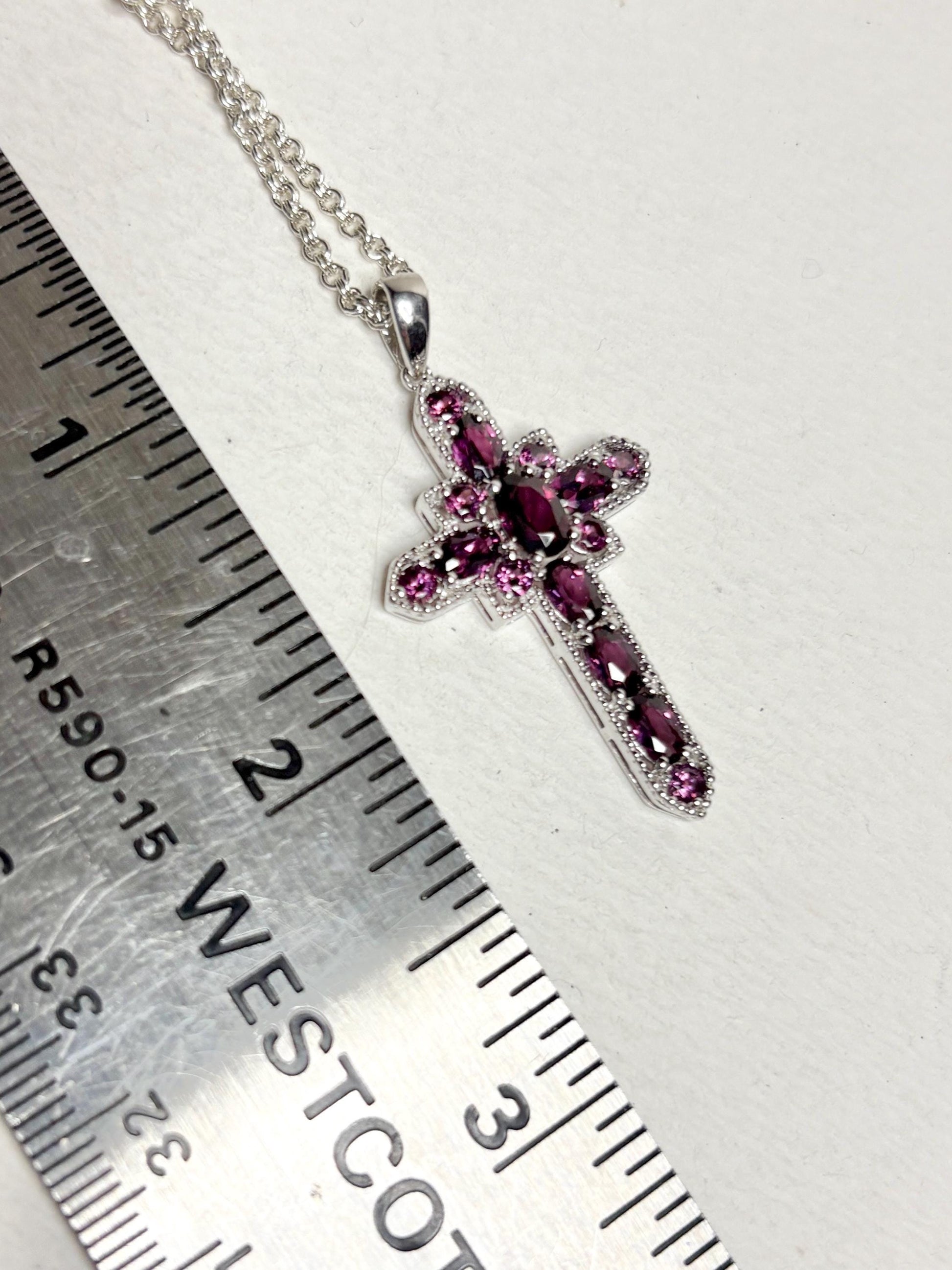Sterling silver cross pendant necklace with rhodolite garnets.