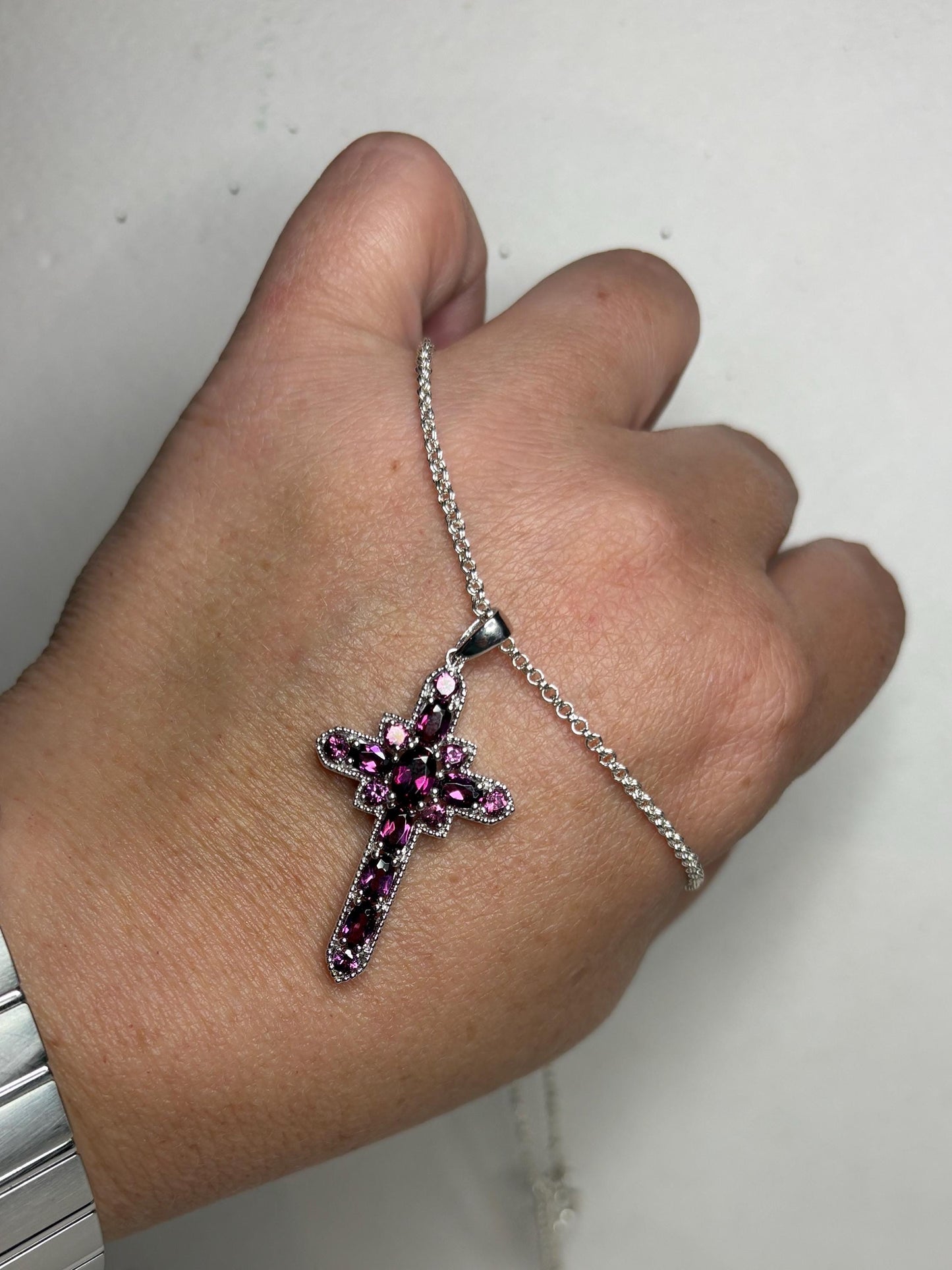 Sterling silver cross pendant necklace with rhodolite garnets.