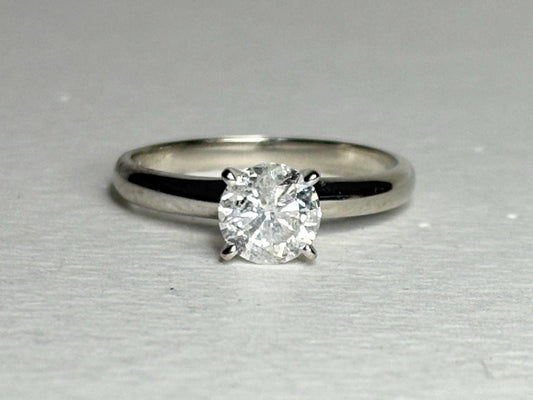 A 1ct round solitaire diamond ring in a 10k white gold band.