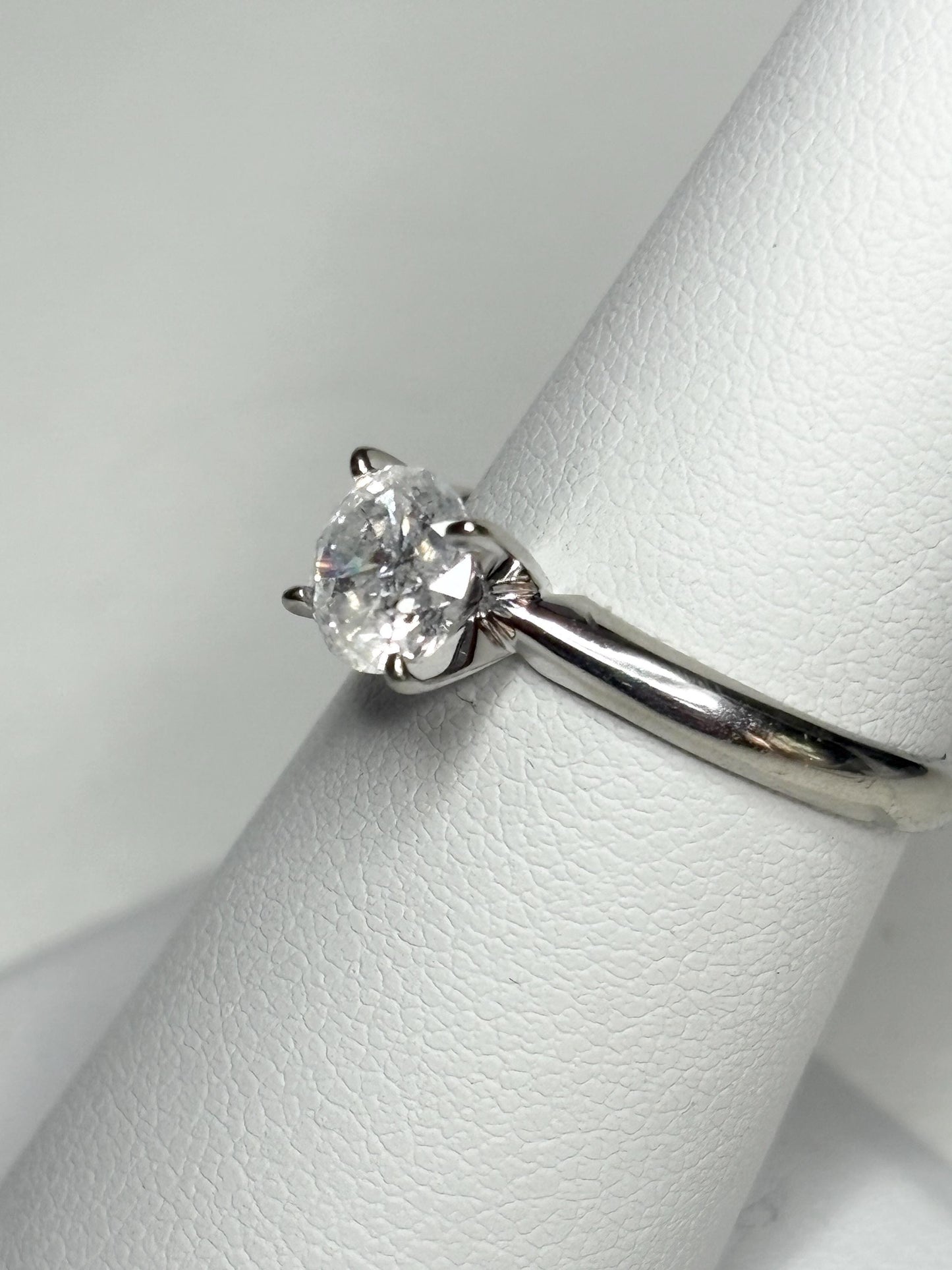 A 1ct round diamond solitaire ring in 10k white gold.