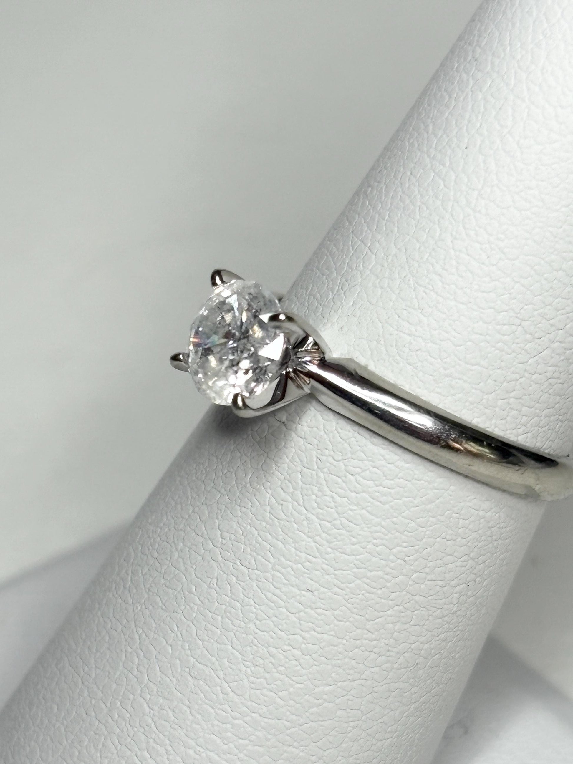 A 1ct round diamond solitaire ring in 10k white gold.