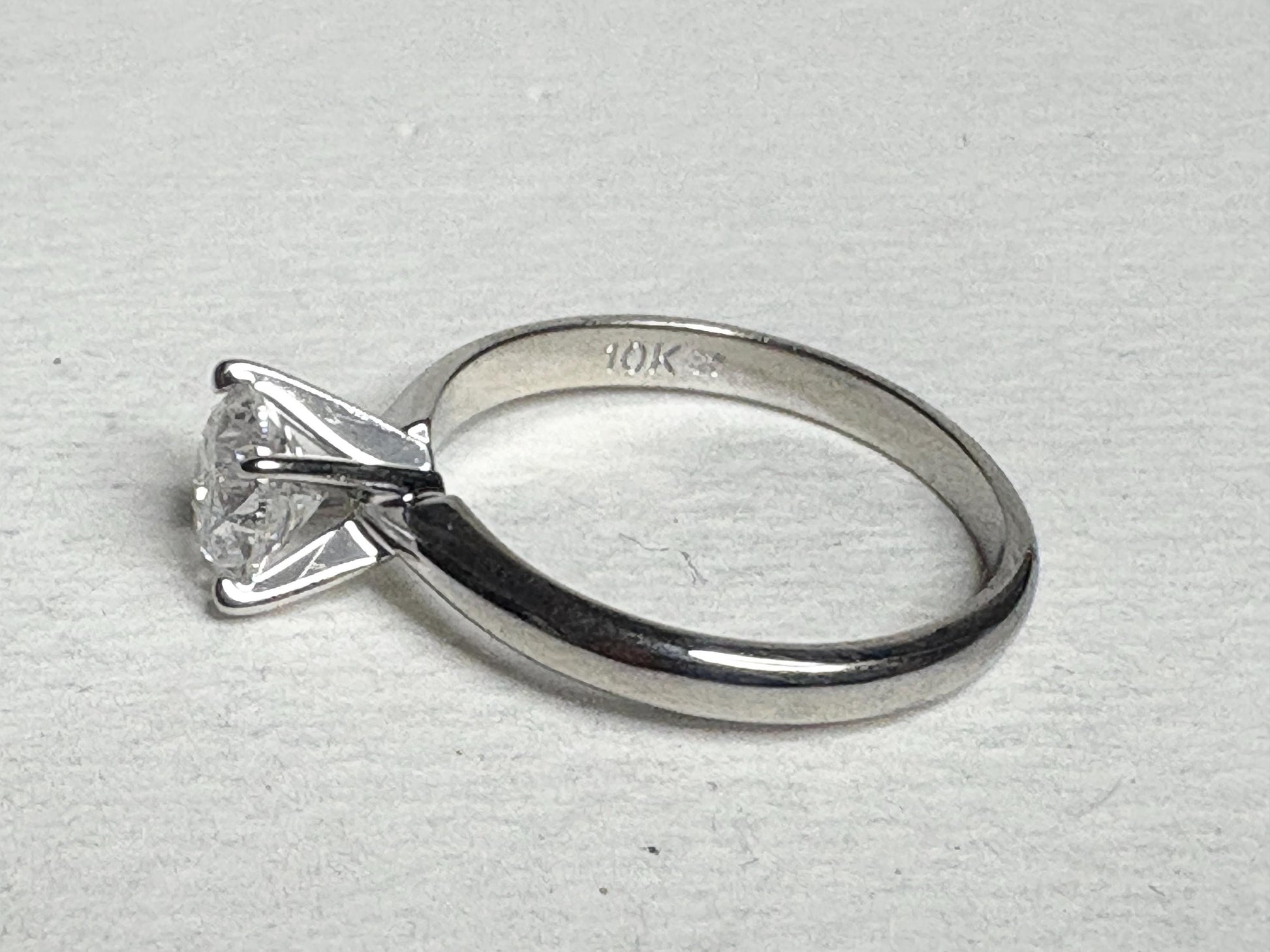 10k white gold ring with a 1ct round diamond.