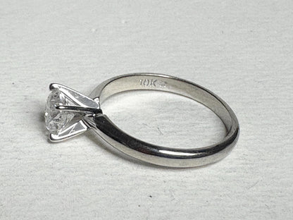 10k white gold ring with a 1ct round diamond.