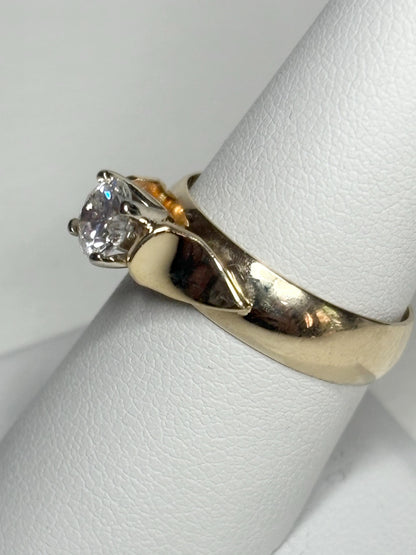 Vintage 14k gold band ring with a .75ct diamond.