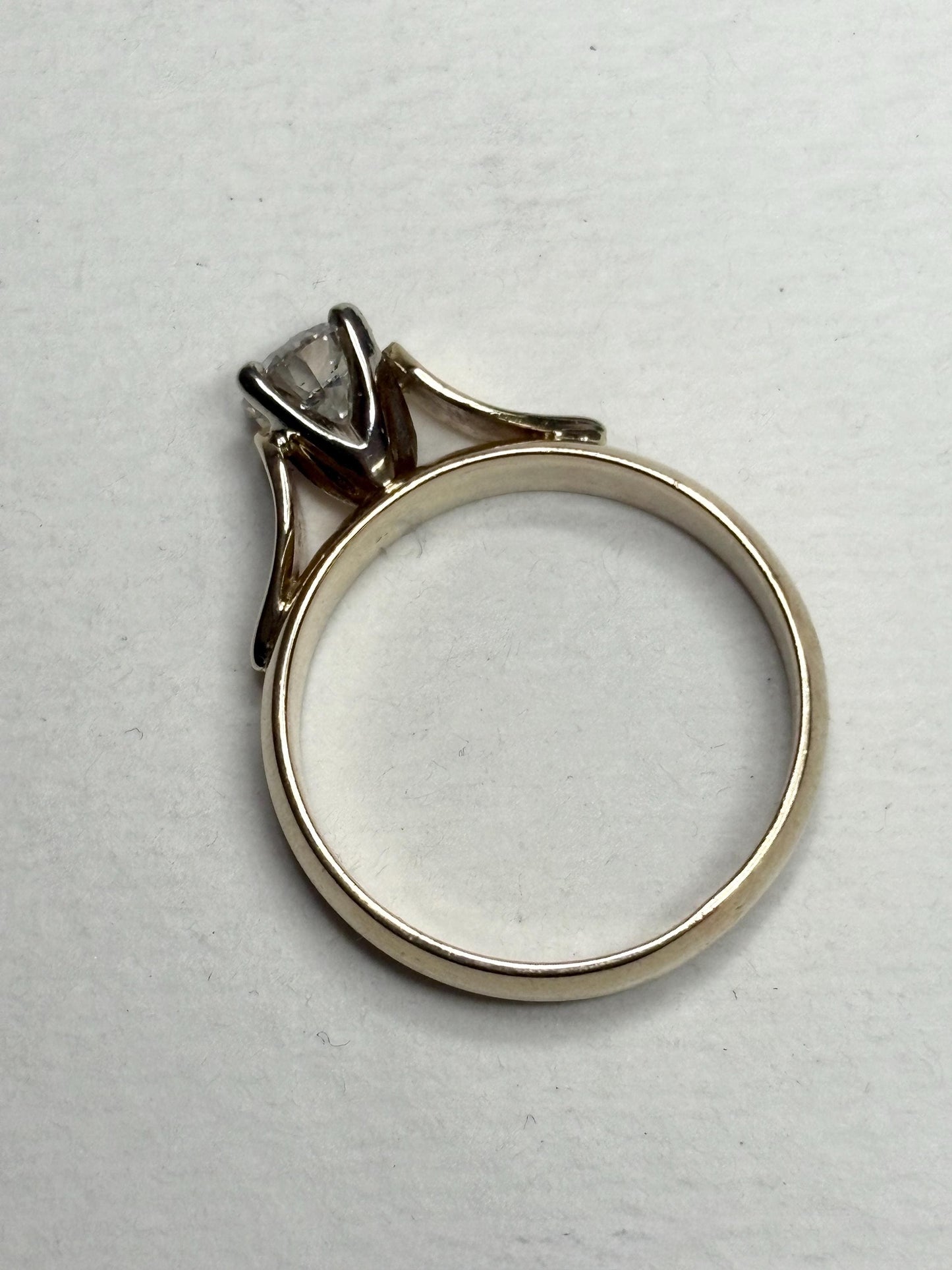 A vintage 14k gold solitaire ring with a .75ct diamond.