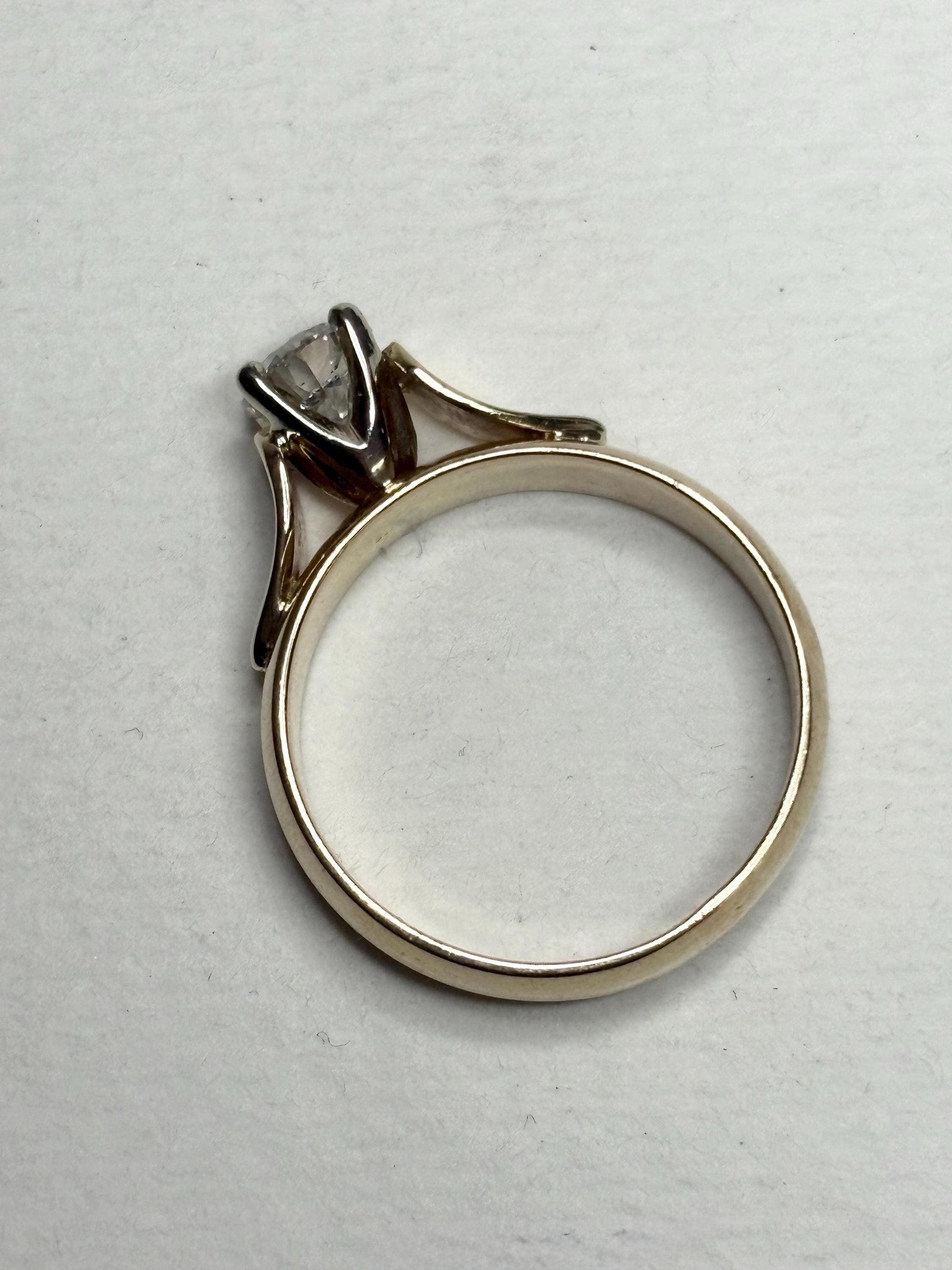 A vintage 14k gold solitaire ring with a .75ct diamond.