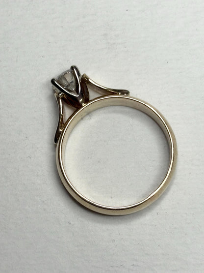 A vintage 14k gold solitaire ring with a .75ct diamond.