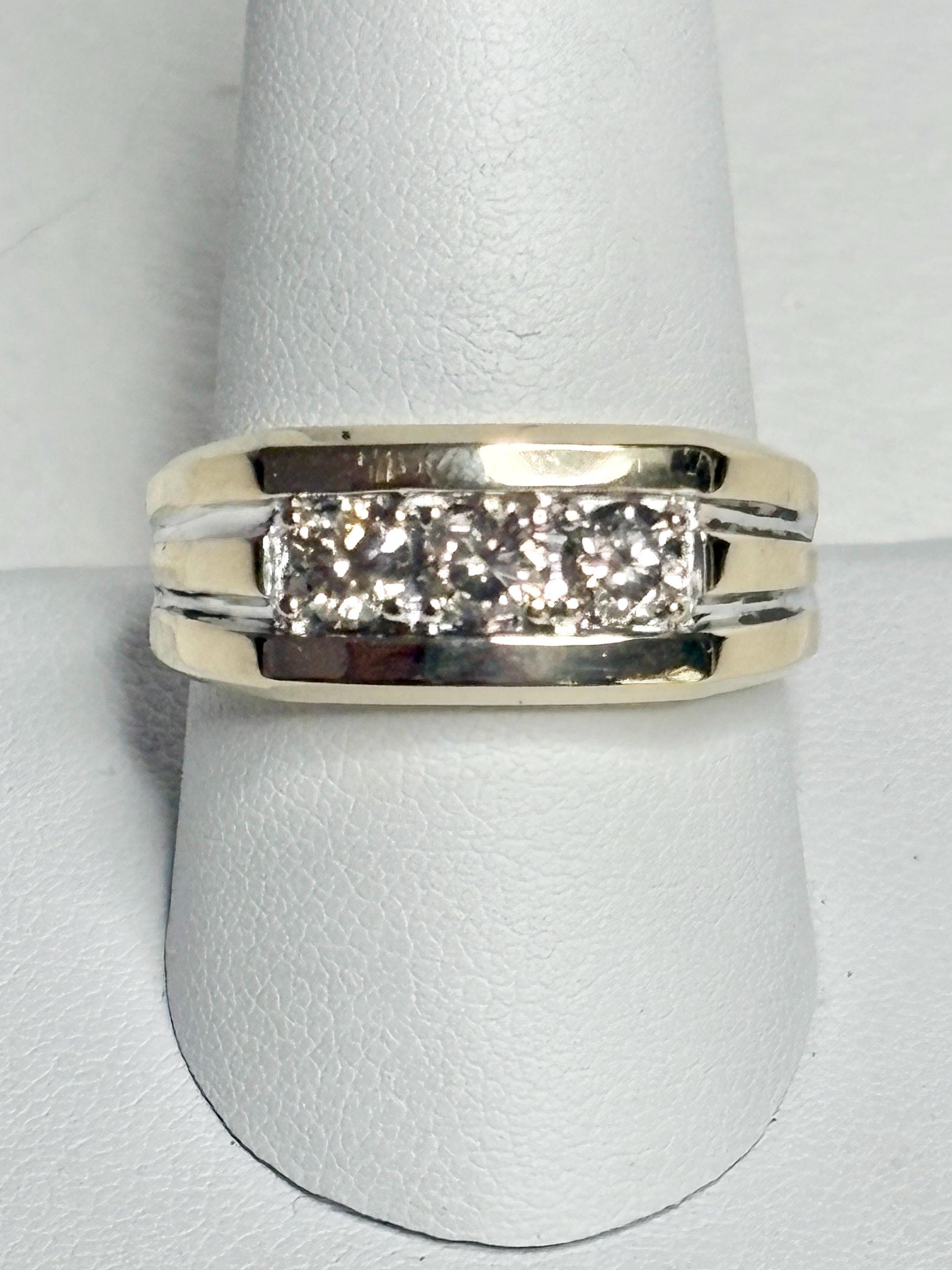 Men's 14k gold band ring with three champagne diamonds.
