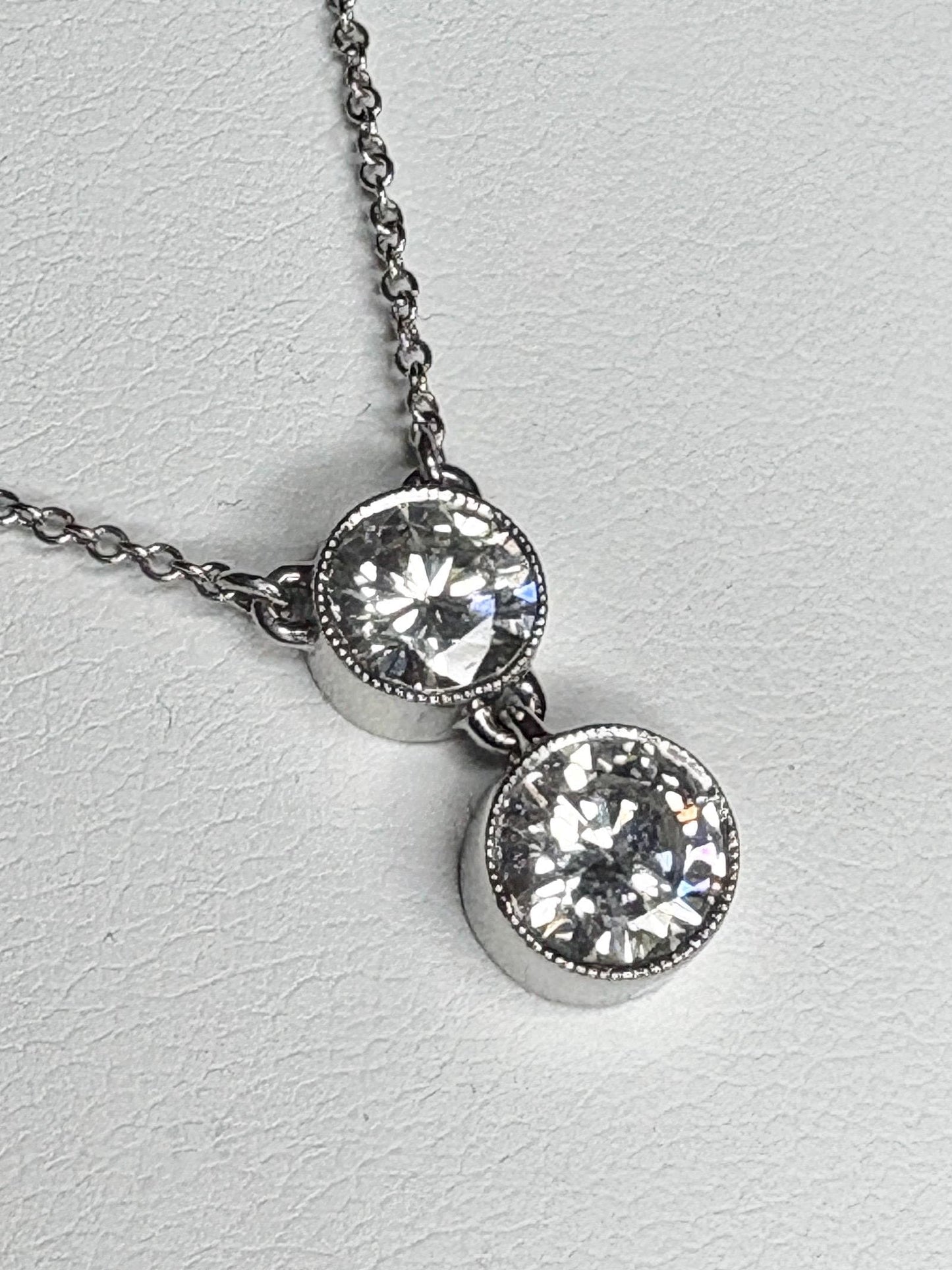Custom double solitaire natural diamond necklace in solid 14k white gold.