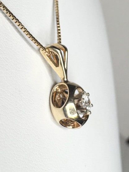 Vintage 14k gold pendant necklace with a solitaire diamond on a box chain.