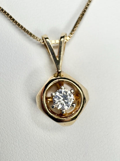 Vintage 14k gold pendant necklace with a round diamond on a box chain.