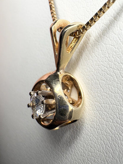 Vintage 14k gold pendant necklace with a round diamond on a box chain.