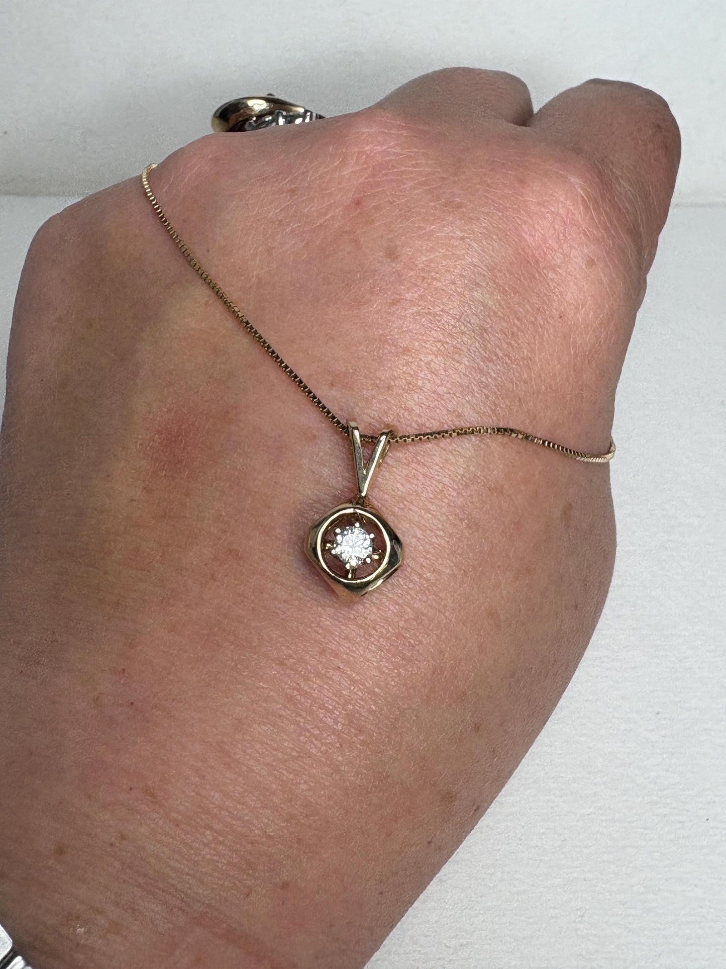 Vintage 14k gold pendant necklace with a diamond solitaire.